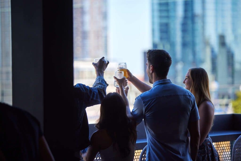 Margaux Midtown residents cheersing on Sky Lounge